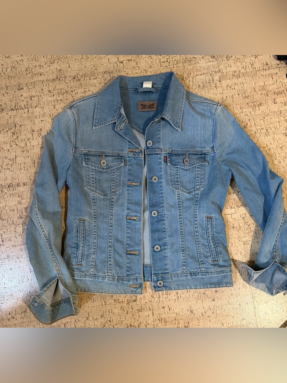 Levi’s women’s light-wash denim trucker jacket, size L/G